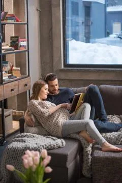 Young couple using digital tablet Stock Photos