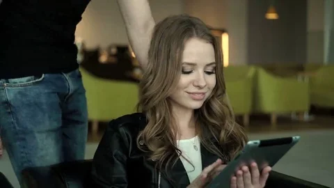 Young couple using electronic tablet in cafe Stock Footage 69202955