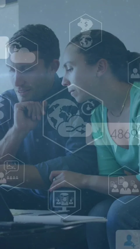 A young couple is using a laptop to pay their bills and talk to each other Stock Footage 344745559
