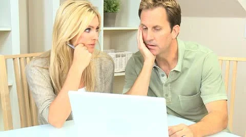 Young Couple Using Laptop for Personal Finances Stock Footage 8987879