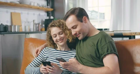 Young couple using mobile phones Stock Footage 114123457