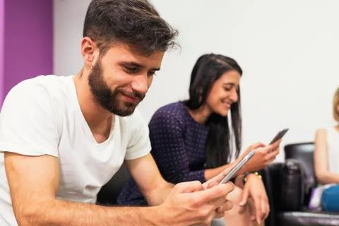 Young couple using mobile. Stock Photos