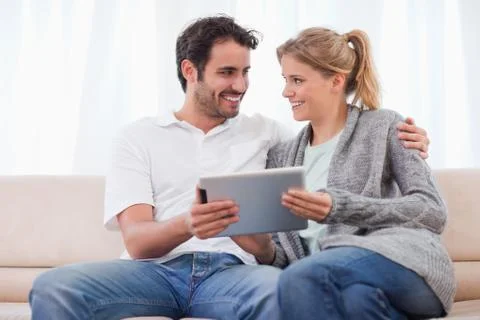 Young couple using a tablet computer Stock Photos