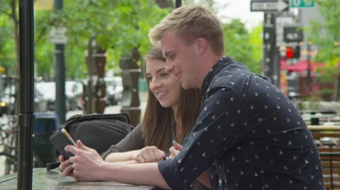 Young couple using tablet Stock Footage 67364162