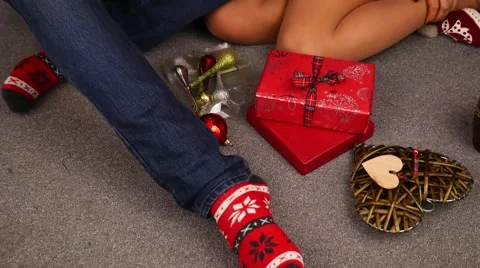 Young couple using tablet pc. Christmas time. 50 fps. Stock Footage 57369249