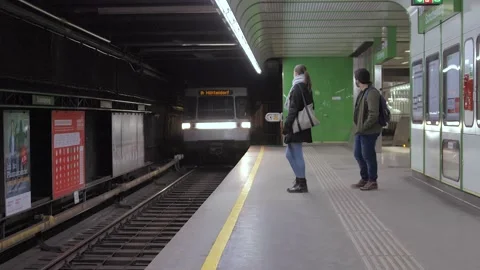 Young Couple waiting for subway until it's arrival. Slow motion Stock Footage 149082873