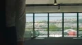 Young couple walking across overpass, man carrying suitcase, personal driver HD Footage