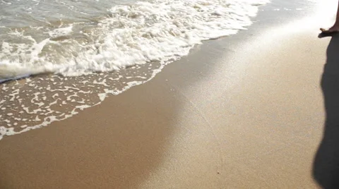 Young couple walking on beach Stock Footage 43618115