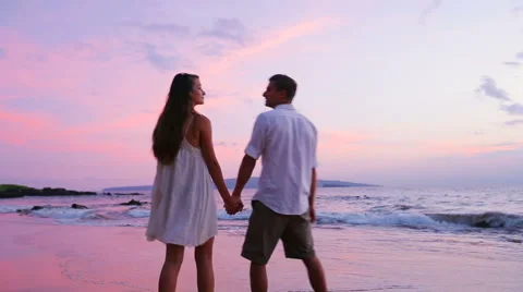 Young Couple Walking on Beach Stock Footage 52551783