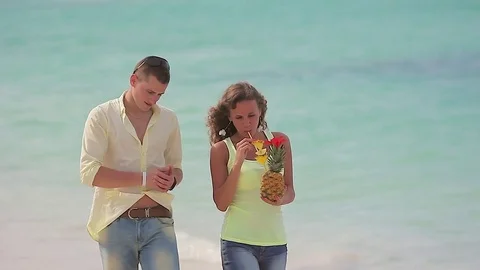 Young couple walking on the beach Video stock 81712918