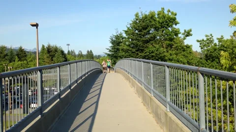 Young couple walking on the bridge Stock Footage 39654557