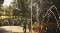 Young couple walking in green park. Man and woman on romantic date. Summer day HD Footage