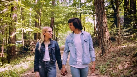 Young Couple Walking, Hand In Hand, Through Forest Video stock 89891673