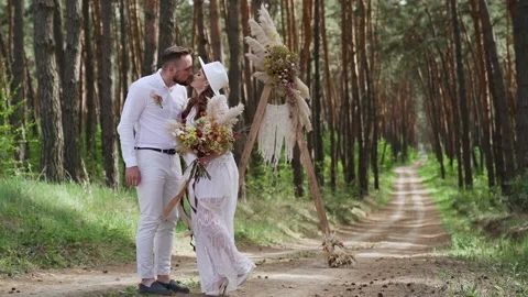 Young couple walking holding hands hugging in autumn forest. Slow motion Stock Footage 204940924