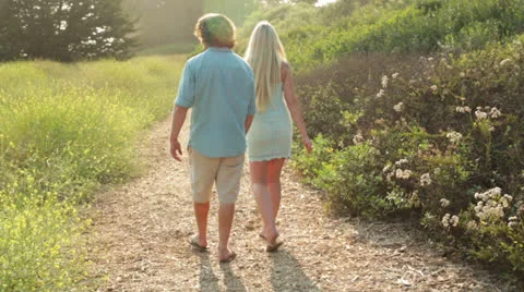 Young Couple Walking in Nature Stock Footage 25571600