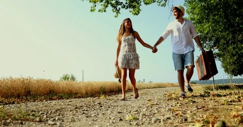 Young couple walking in a path in a countryside Video stock 77117743
