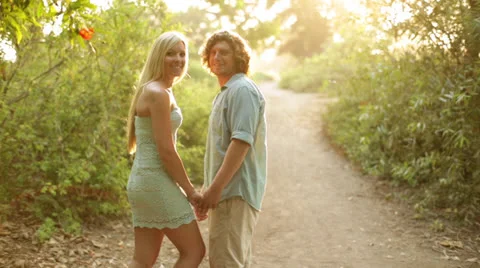 Young Couple Walking Path in Nature Stock Footage 25571385