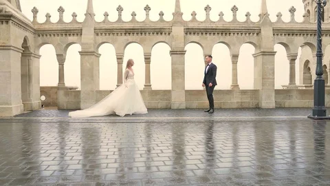 Young couple walking silhouette go together past architecture of old castle and  Stock Footage 129508313