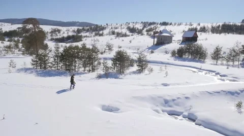 Young couple walking on the snow Stock Footage 58744419