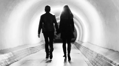 A young couple walking through the tunnel of life Video stock 59952207