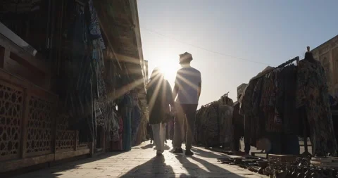 Young couple walking together through Uzbek national souvenirs and gifts shops Stock Footage 272177111