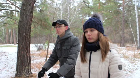 Young couple walking in the woods in first snow Stock Footage 56527668