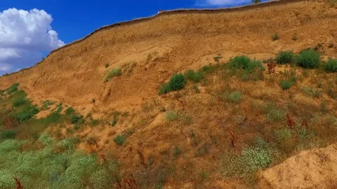 Young couple walks on a cliff beautiful nature wind farm Stock Footage 128038136