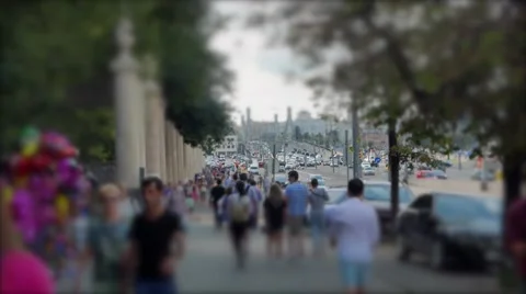 A young couple walks through a crowded sidewalk. 4k Video stock 55585949