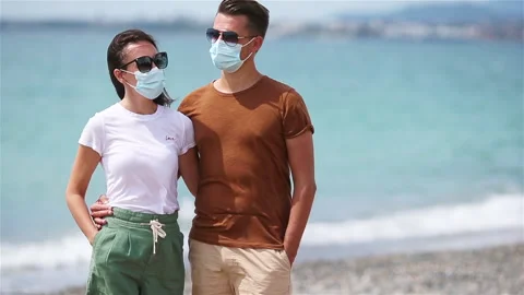 Young couple on white beach during summer vacation. Stock Footage 138669313
