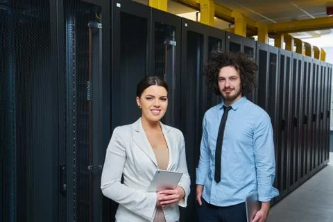 Young couple working at a data center Stock Photos