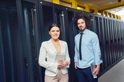 Young couple working at a data center Stock Photos