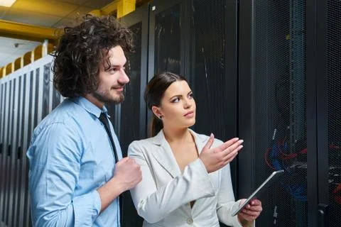 Young couple working at a data center Stock Photos