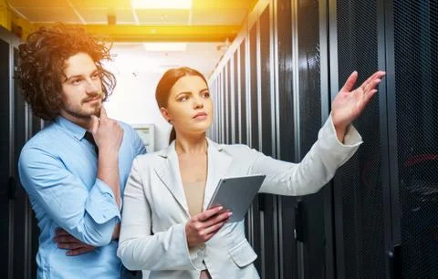 Young couple working at a data center Stock Photos