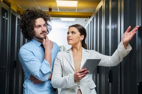 Young couple working at a data center Stock Photos