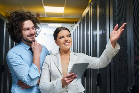 Young couple working at a data center Stock Photos