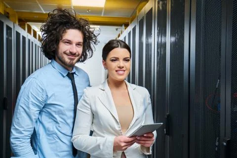 Young couple working at a data center Stock Photos