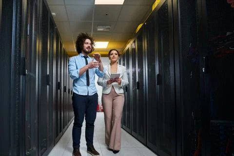 Young couple working at a data center Stock Photos