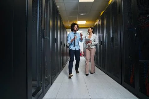 Young couple working at a data center Stock Photos