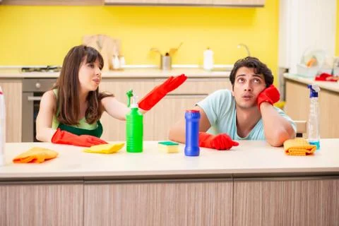 Young couple working at kitchen Фото