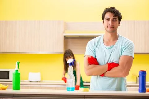 Young couple working at kitchen Fotos Stock