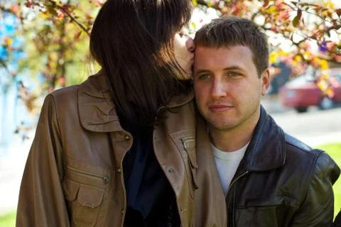 Young couple at flowering tree Stock Photos