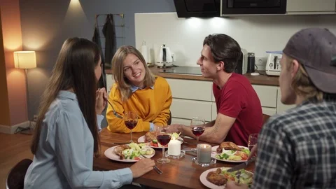 Young couples having fun at dinner Stock Footage 114810748