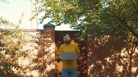 A young courier delivers the parcel Stock Footage 90989105