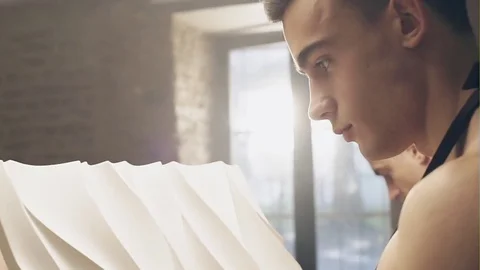 Young craftsman inspecting plaster work | Stock Video | Pond5