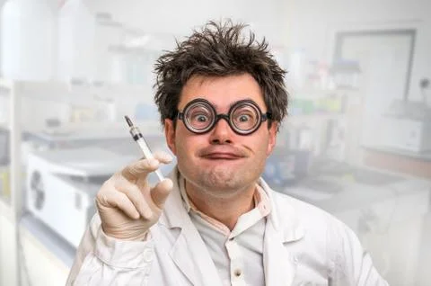 Young crazy doctor performing experiments in hospital Foto stock