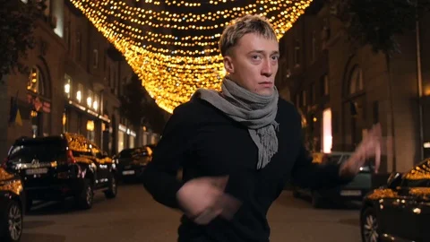 Young crazy guy crazy dance at night street Stock Footage 118124740