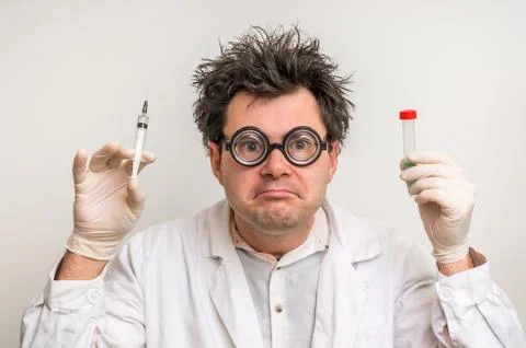 Young crazy scientist performing experiments in laboratory Stock Photos