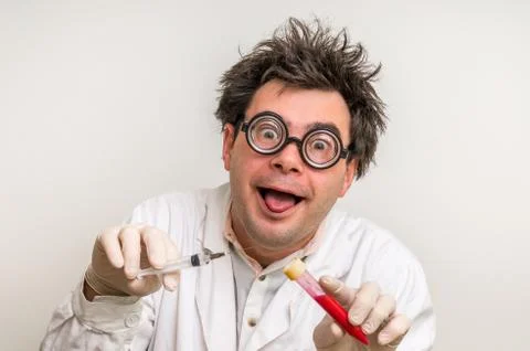 Young crazy scientist performing experiments in laboratory Stock Photos