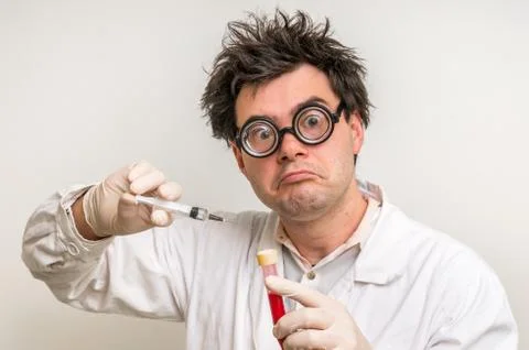 	Young crazy scientist performing experiments in laboratory Stock Photos