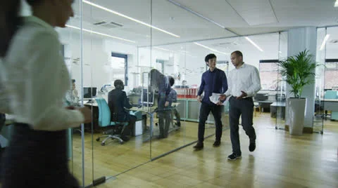 Young creative business team working together in a light contemporary office Video stock 25880282